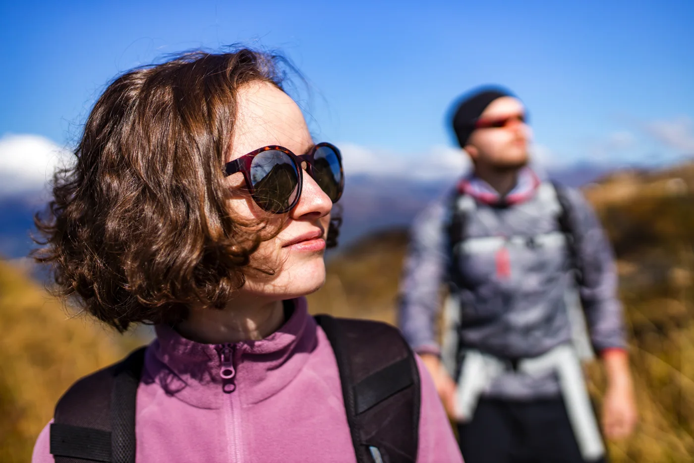 hikers-newwedding-with-backpacks-relaxing-on-top-o-2026-03-10-22-22-00-utc x 1400