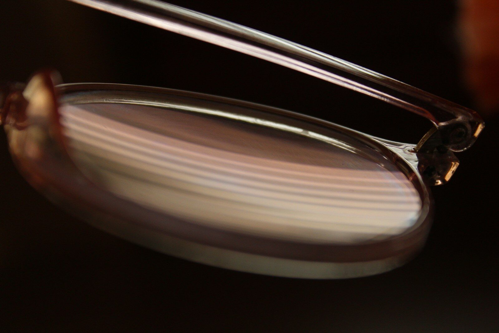 Close-up of layered agate stone with brown and white stripes.