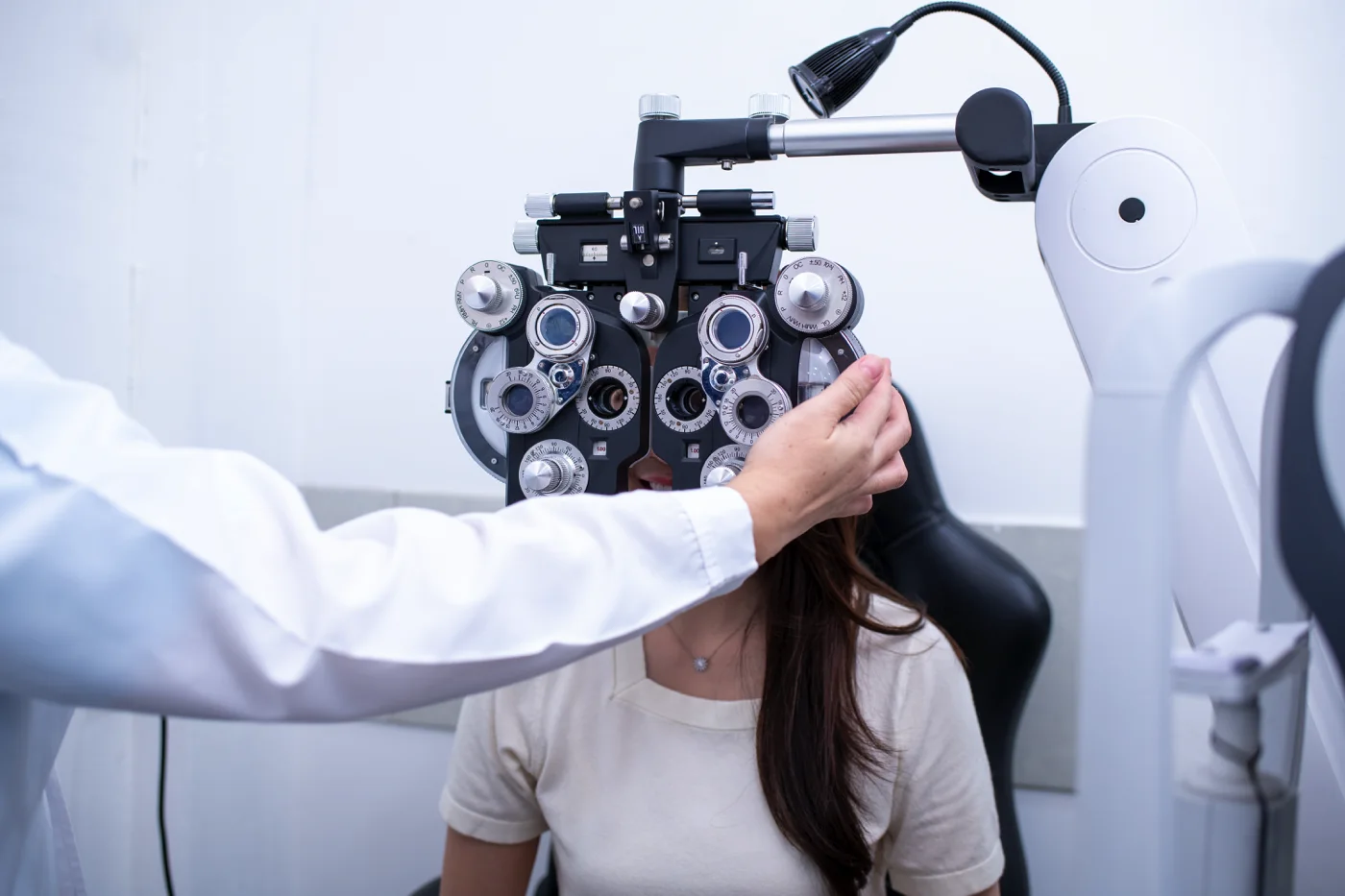 woman-optical-shop-customer-doing-eyesight-measure-2026-03-24-05-26-00-utc x 1400